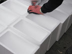 Insulated foam shipper bodies (white EPS boxes) lined up, shown without outer cartons